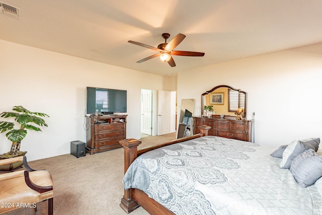 bedroom featuring light carpet and ceiling fan