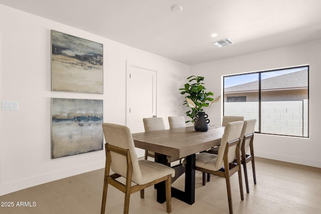 dining space featuring light wood-style flooring, visible vents, baseboards, and recessed lighting