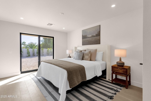 bedroom with light wood-type flooring, access to outside, visible vents, and recessed lighting