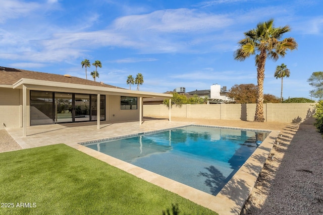 view of pool with a fenced in pool, a fenced backyard, a patio, and a lawn