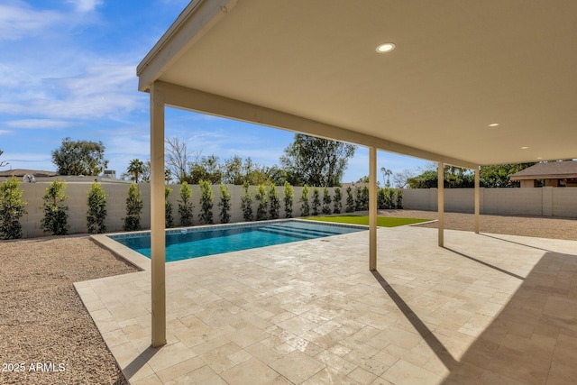 view of pool featuring a fenced in pool, a fenced backyard, and a patio