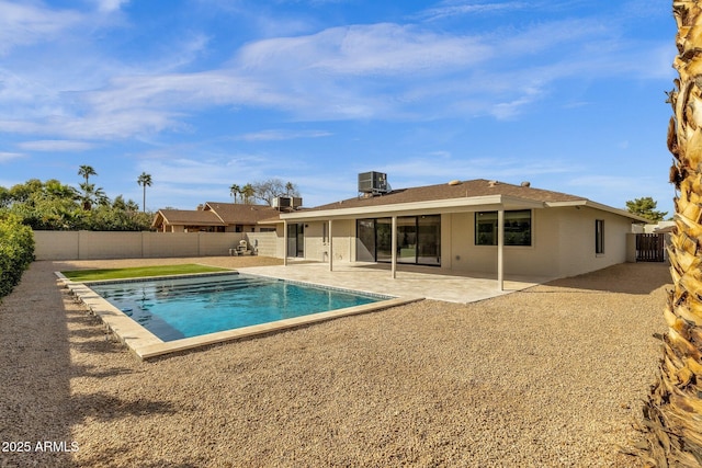 view of swimming pool with a fenced in pool, a fenced backyard, a patio, and central AC