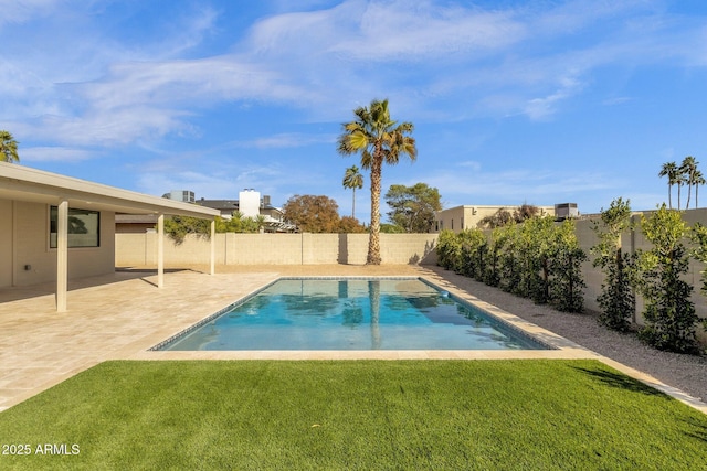 view of swimming pool with a fenced in pool, a fenced backyard, a yard, and a patio