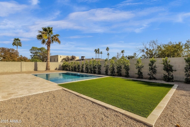 view of pool with a patio area, a fenced backyard, a fenced in pool, and a yard