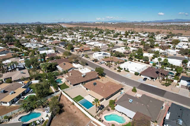 birds eye view of property with a residential view