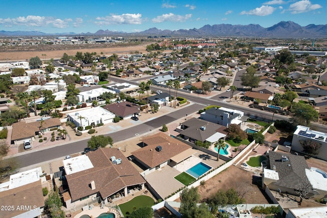 drone / aerial view featuring a residential view and a mountain view