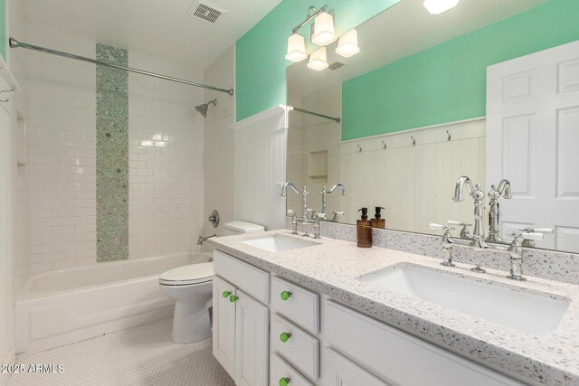 bathroom with toilet, tile patterned flooring, bathing tub / shower combination, and double vanity