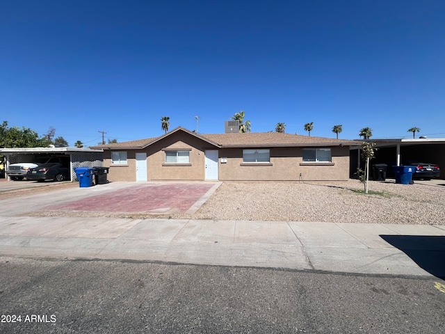 view of front of home featuring a carport