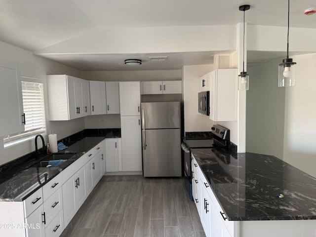 kitchen featuring white cabinets, a sink, and stainless steel appliances