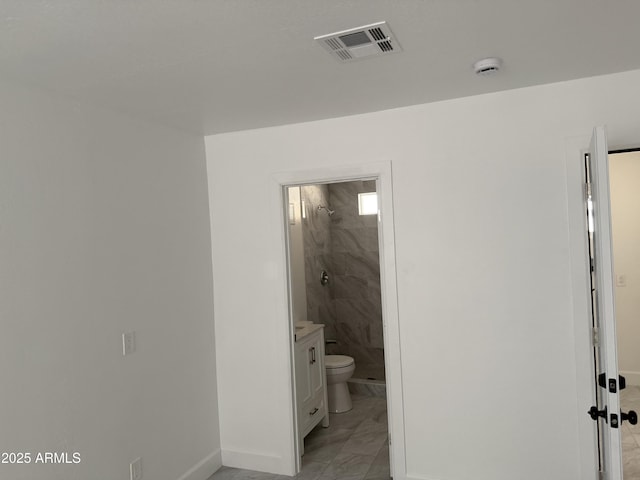 full bathroom with vanity, a stall shower, baseboards, and visible vents