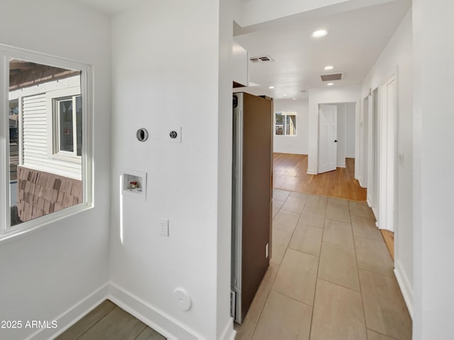 hallway with light tile patterned flooring