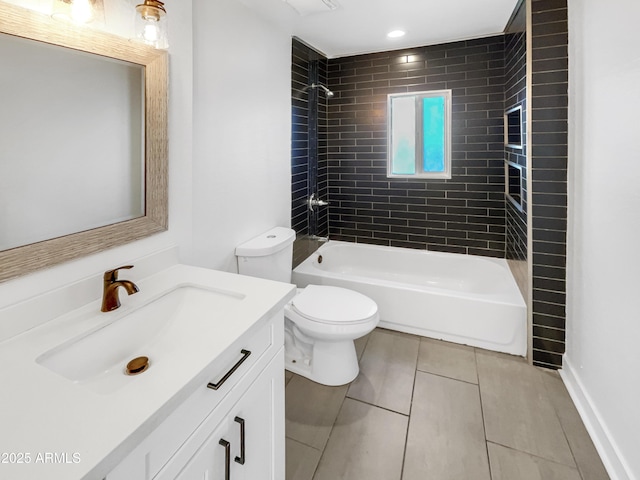 full bathroom with tile patterned flooring, vanity, tiled shower / bath combo, and toilet