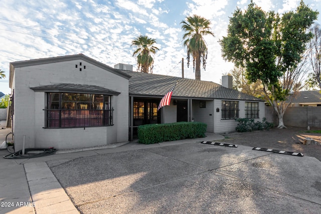 ranch-style house featuring a patio area