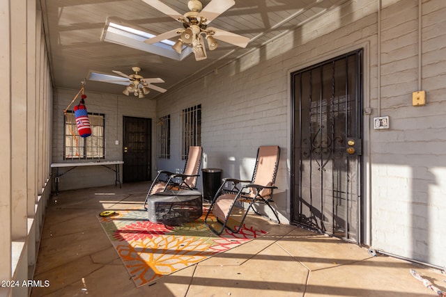 exterior space with ceiling fan