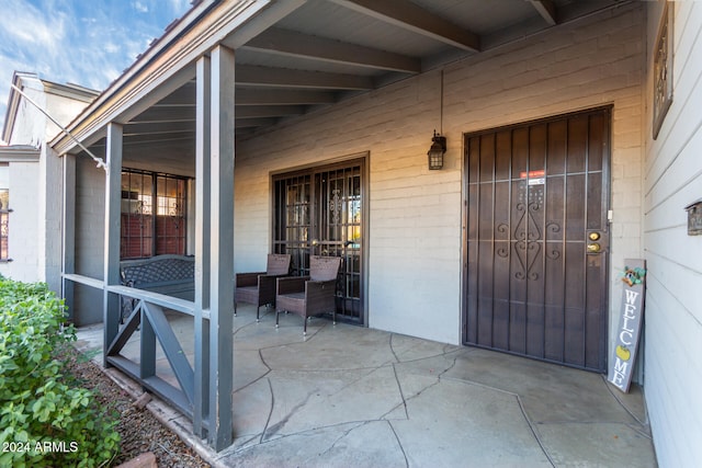 doorway to property with a patio