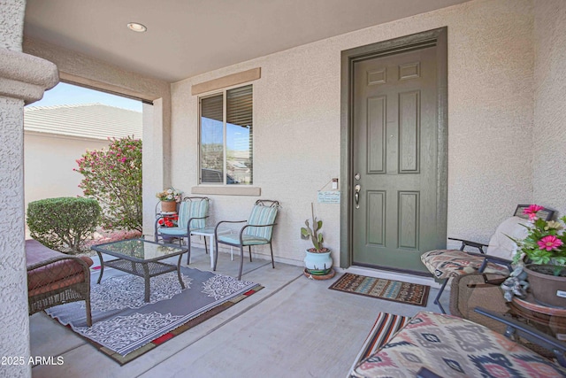 view of exterior entry featuring stucco siding