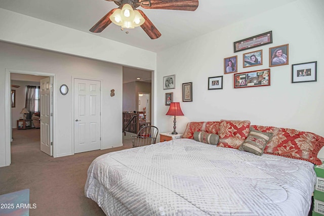 carpeted bedroom with a ceiling fan