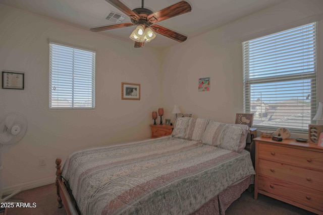 bedroom with baseboards, carpet, visible vents, and a ceiling fan