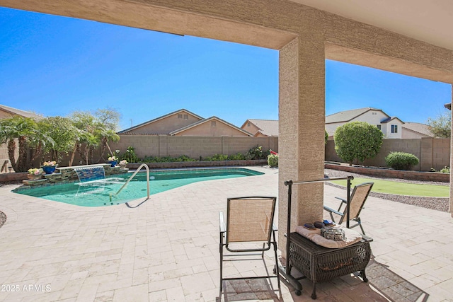 view of pool featuring a patio area, a fenced backyard, and a fenced in pool