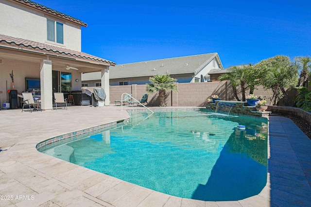 view of swimming pool with a patio area, a fenced backyard, a fenced in pool, and a ceiling fan