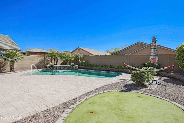 view of swimming pool with a fenced backyard, a fenced in pool, and a patio