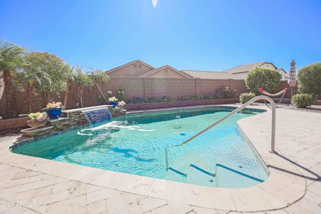 view of swimming pool featuring a fenced backyard, a fenced in pool, and a patio