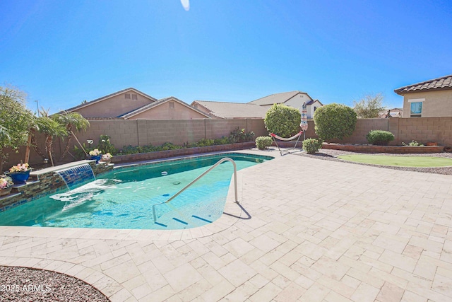 view of swimming pool featuring a patio area, a fenced backyard, and a fenced in pool