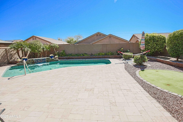 view of pool with a patio area, a fenced backyard, and a fenced in pool