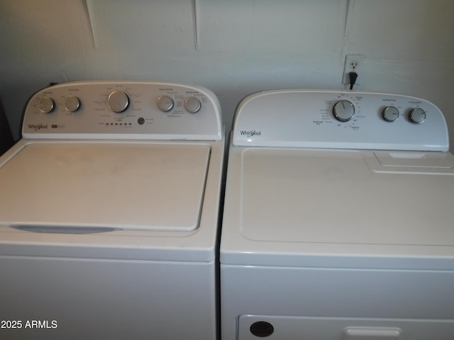 laundry area with washing machine and dryer