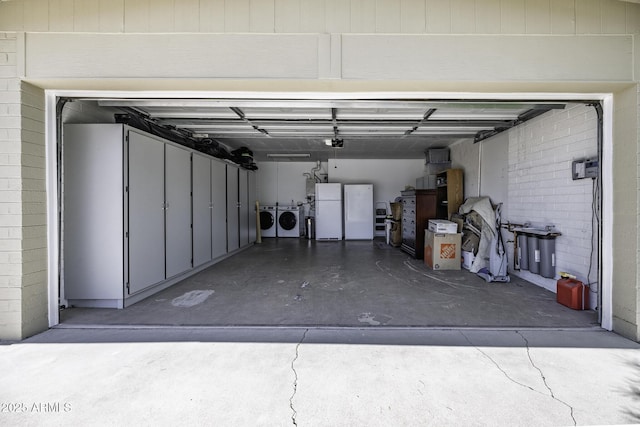 308 E Ln Jolla Dr, Tempe, AZ 85282 - garage with washing machine and clothes dryer, freestanding refrigerator, and a garage door opener