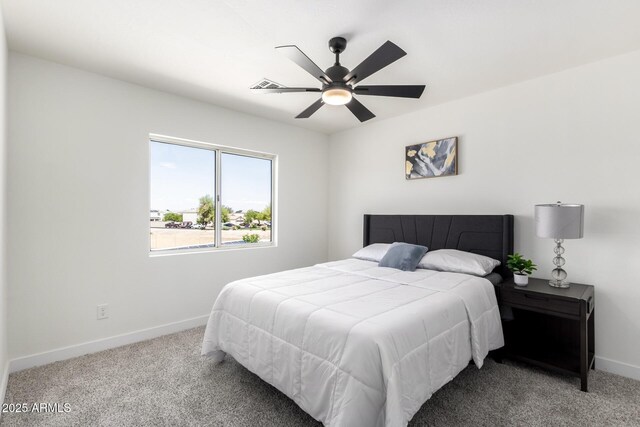 bedroom with ceiling fan, baseboards, visible vents, and carpet