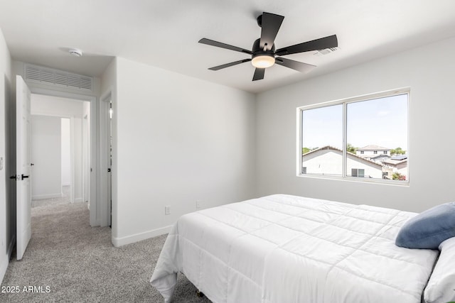 bedroom with baseboards, visible vents, carpet floors, and ceiling fan