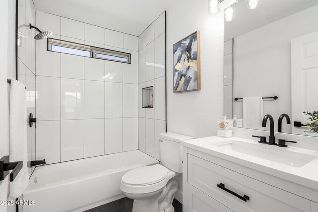 full bathroom with toilet, vanity, and tub / shower combination