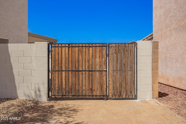 view of gate with fence