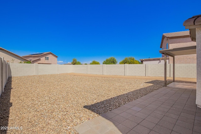 view of yard with a patio area and a fenced backyard