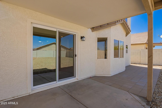 view of patio / terrace featuring fence