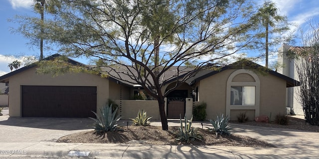 ranch-style house featuring a garage