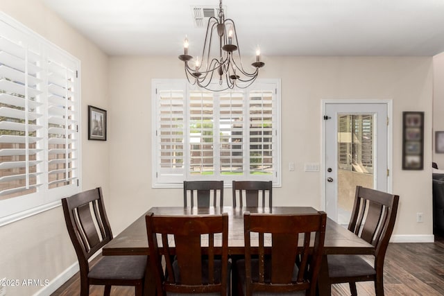 16565 W Garfield St, Goodyear, AZ 85338 - dining room with dark wood finished floors, a chandelier, and baseboards
