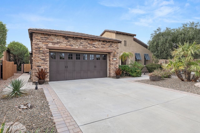 view of front of property featuring a garage