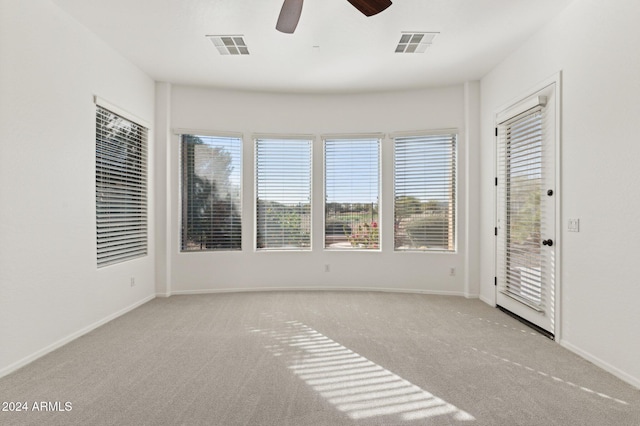 carpeted empty room with ceiling fan