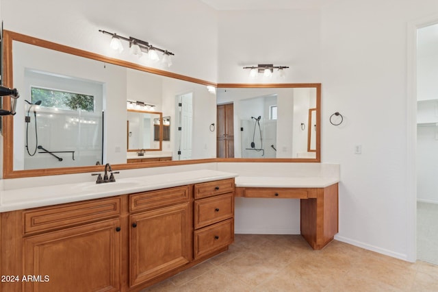 bathroom with vanity and a shower