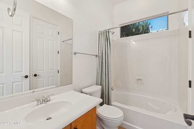 full bathroom featuring toilet, vanity, and shower / tub combo with curtain