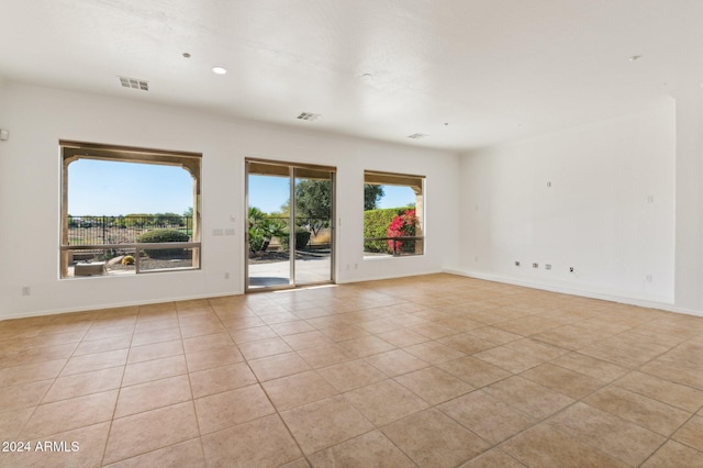 unfurnished room with light tile patterned floors