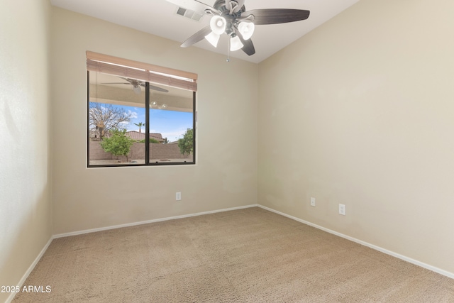 spare room with visible vents, baseboards, carpet flooring, and a ceiling fan