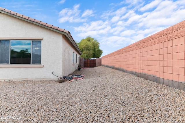 view of home's exterior featuring stucco siding and a fenced backyard