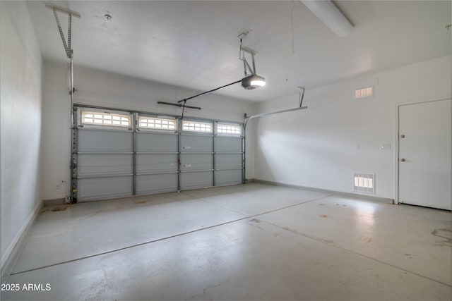 garage featuring baseboards and a garage door opener