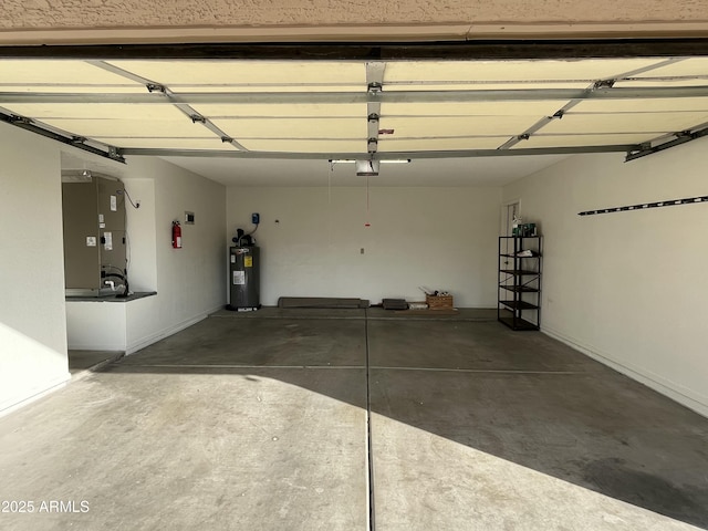 garage featuring heating unit, electric water heater, and a garage door opener