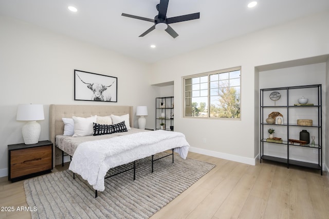 bedroom featuring ceiling fan and light hardwood / wood-style floors