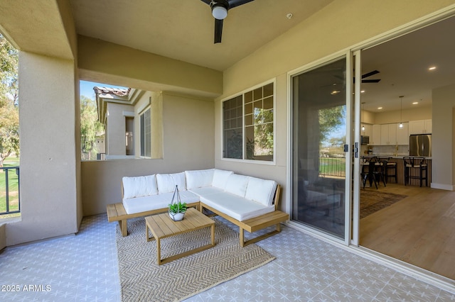 view of patio featuring an outdoor hangout area and ceiling fan