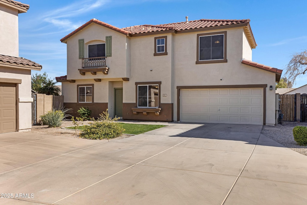 mediterranean / spanish-style home featuring a garage